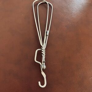 2 Vintage metal foldable clothes hangers.